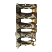 Rear mating face of a salvaged BMW B47 exhaust manifold heat deflector, visually inspected for warping and structural integrity.