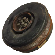 Front view of a salvaged BMW crankshaft vibration damper pulley, complete with the four original Torx mounting bolts resting in the centre hub.