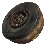 Front view of a salvaged BMW crankshaft vibration damper pulley, complete with the four original Torx mounting bolts resting in the centre hub.