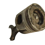 Close up angled view of a genuine BMW diesel piston crown, showing the combustion bowl and valve reliefs.