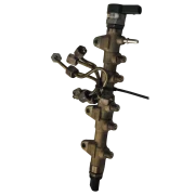 Angled view of a salvaged BMW B47 diesel common fuel rail, showing the injector feed ports and regulator. Tested and supplied by Smart Drive Car Parts.
